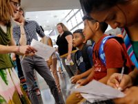 1009397793 ma nb HayMacFistDay  Teachers help parents and students identify where their classes are on the first day of school at the Hayden McFadden Elementary School in New Bedford.  PETER PEREIRA/THE STANDARD-TIMES/SCMG : education, school, students